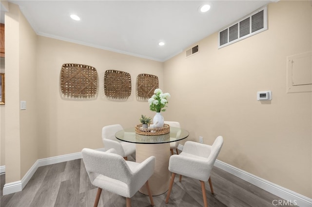 3020 Associated Rd Unit 110, Fullerton, CA 92835 - dining area with wood finished floors, recessed lighting, and crown molding
