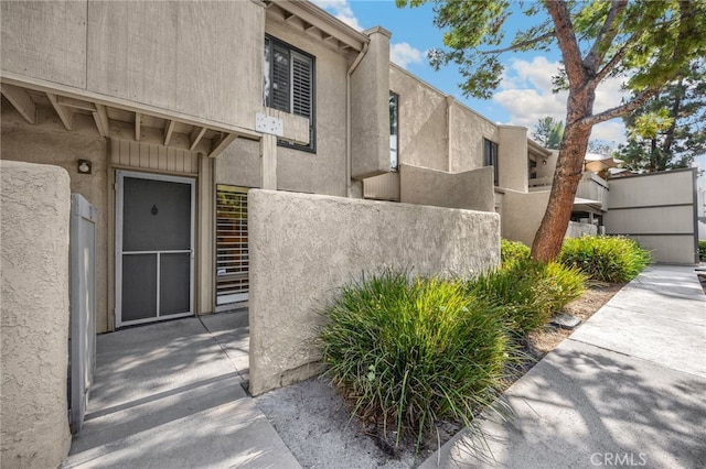 3020 Associated Rd Unit 110, Fullerton, CA 92835 - view of exterior entry featuring stucco siding