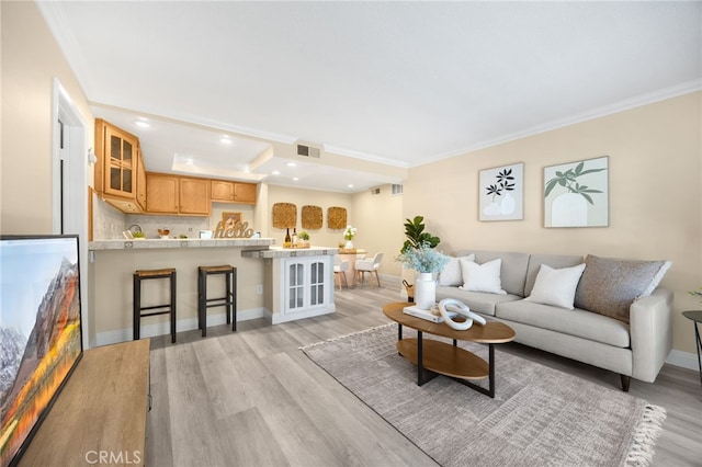 3020 Associated Rd Unit 110, Fullerton, CA 92835 - living area featuring light wood-type flooring, recessed lighting, and crown molding