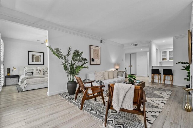 4949 Genesta Ave Unit 102, Encino, CA 91316 - living room featuring a ceiling fan, ornamental molding, light wood-style floors, and recessed lighting