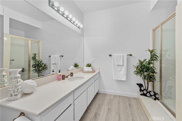 4949 Genesta Ave Unit 102, Encino, CA 91316 - full bath with vanity, a shower stall, and wood finished floors