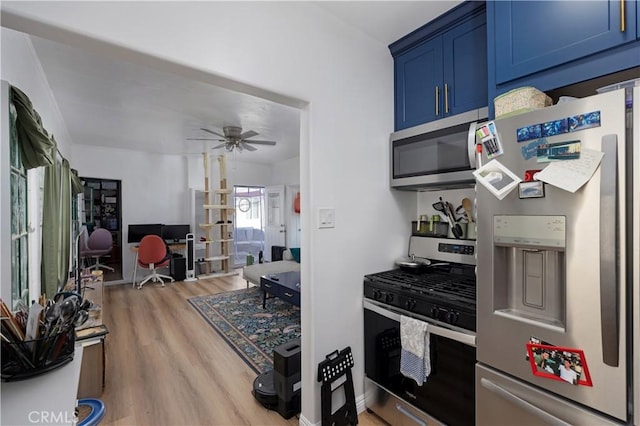 28 Argonne Ave, Long Beach, CA 90803 - kitchen with appliances with stainless steel finishes, blue cabinetry, a desk, light wood-type flooring, and a ceiling fan