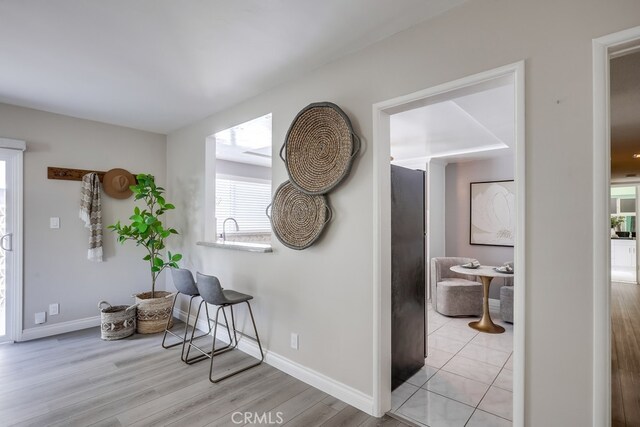 1354 Shadow Ln Unit 102, Fullerton, CA 92831 - hallway with light wood-style flooring and baseboards