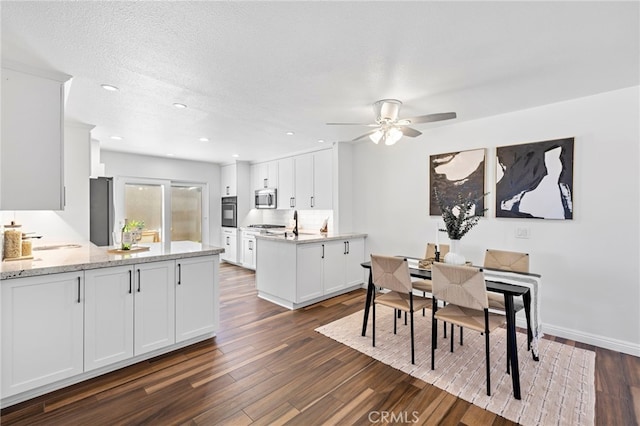 18714 Maplewood Cir, Huntington Beach, CA 92646 - dining room with dark wood-style floors, ceiling fan, and recessed lighting