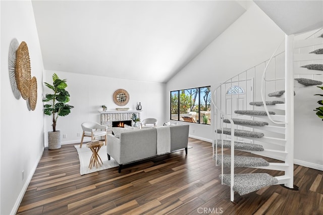 18714 Maplewood Cir, Huntington Beach, CA 92646 - living area with dark wood-style floors, a fireplace, and high vaulted ceiling