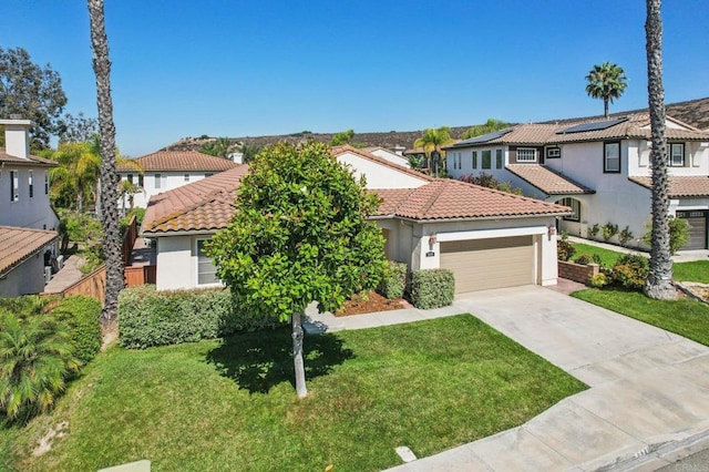 568 Scenic Trail Pl, Chula Vista, CA 91914 - mediterranean / spanish house with a residential view, stucco siding, an attached garage, a tiled roof, and driveway