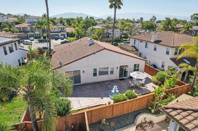 568 Scenic Trail Pl, Chula Vista, CA 91914 - back of house featuring a residential view, a fenced backyard, a patio, and a mountain view