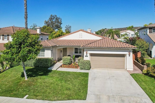 568 Scenic Trail Pl, Chula Vista, CA 91914 - mediterranean / spanish-style home featuring an attached garage, stucco siding, a front yard, and concrete driveway