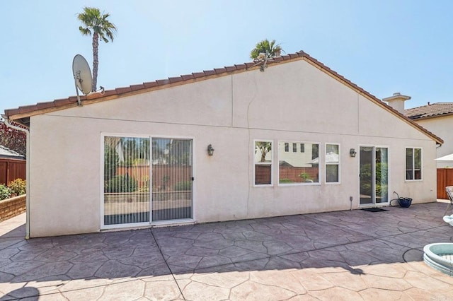 568 Scenic Trail Pl, Chula Vista, CA 91914 - back of property with a patio area, stucco siding, and a tile roof