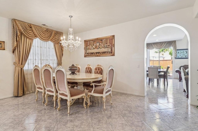 568 Scenic Trail Pl, Chula Vista, CA 91914 - dining area featuring arched walkways and a chandelier