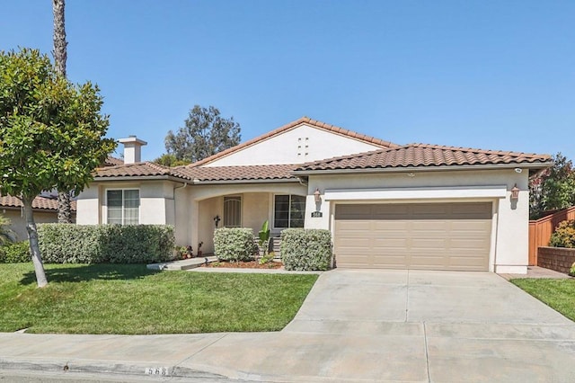 568 Scenic Trail Pl, Chula Vista, CA 91914 - mediterranean / spanish house featuring stucco siding, an attached garage, concrete driveway, and a front lawn