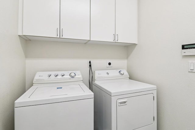 568 Scenic Trail Pl, Chula Vista, CA 91914 - laundry area with washing machine and clothes dryer and cabinet space