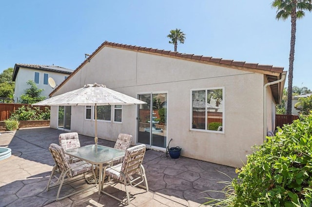 568 Scenic Trail Pl, Chula Vista, CA 91914 - rear view of property featuring stucco siding, a patio, and outdoor dining space