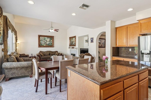 568 Scenic Trail Pl, Chula Vista, CA 91914 - kitchen with stainless steel fridge, open floor plan, arched walkways, a ceiling fan, and recessed lighting
