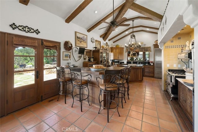 665 Sheehy Rd, Nipomo, CA 93444 - kitchen featuring stainless steel appliances, beamed ceiling, light tile patterned floors, french doors, and tasteful backsplash