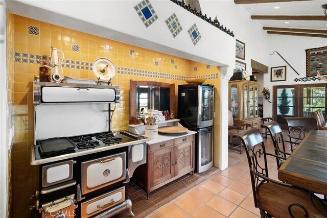 665 Sheehy Rd, Nipomo, CA 93444 - kitchen with freestanding refrigerator, light tile patterned floors, beam ceiling, a high ceiling, and recessed lighting