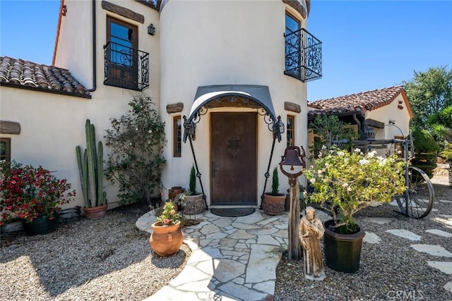 665 Sheehy Rd, Nipomo, CA 93444 - doorway to property with a balcony, stucco siding, and a tiled roof