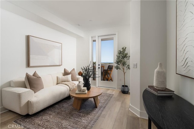 402 W Grand Ave Unit 104, Grover Beach, CA 93433 - living room featuring light wood-style flooring and baseboards