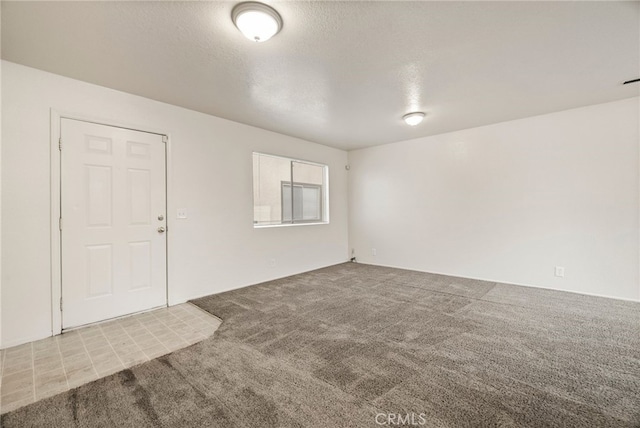 642 W 1st Ave, Chico, CA 95926 - spare room featuring carpet flooring and a textured ceiling