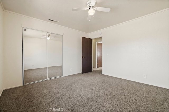 642 W 1st Ave, Chico, CA 95926 - unfurnished bedroom featuring carpet, ornamental molding, a ceiling fan, and a closet