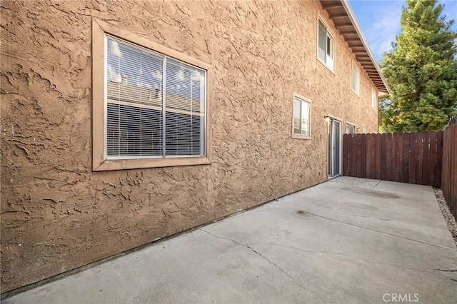 642 W 1st Ave, Chico, CA 95926 - view of side of home featuring a patio area and stucco siding