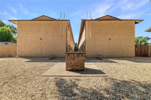 642 W 1st Ave, Chico, CA 95926 - rear view of property with stucco siding and a patio
