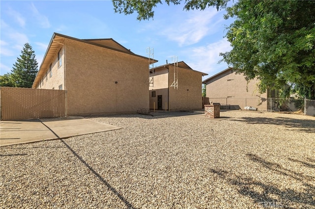 642 W 1st Ave, Chico, CA 95926 - rear view of property featuring stucco siding and a patio area