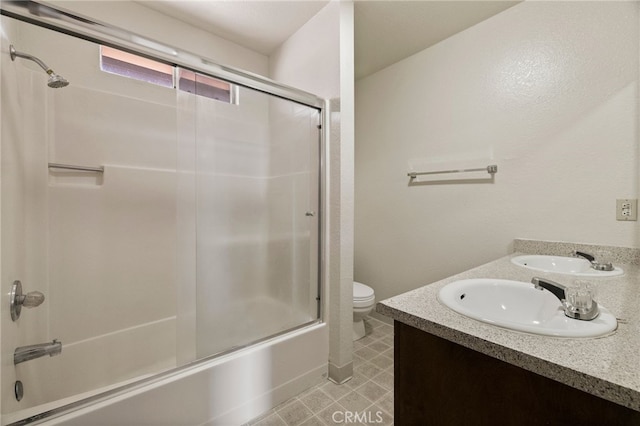 642 W 1st Ave, Chico, CA 95926 - bathroom featuring bath / shower combo with glass door, double vanity, and tile patterned flooring