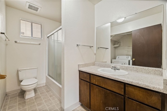 642 W 1st Ave, Chico, CA 95926 - bathroom with vanity, bath / shower combo with glass door, washer and dryer, and tile patterned floors