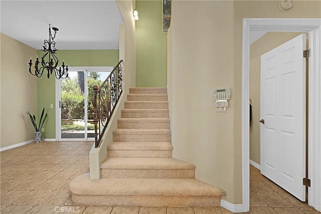26675 Country Creek Ln, Calabasas, CA 91302 - staircase with a chandelier and baseboards