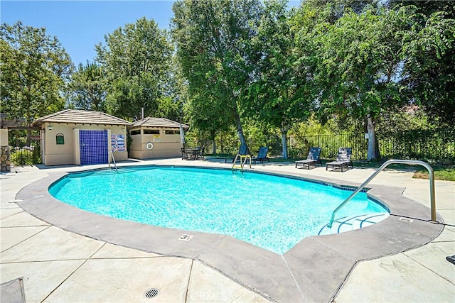26675 Country Creek Ln, Calabasas, CA 91302 - community pool featuring a patio area and view of scattered trees