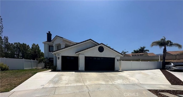 2775 Canyon View Cir, Corona, CA 92882 - view of front of house with concrete driveway, a garage, stucco siding, and a chimney