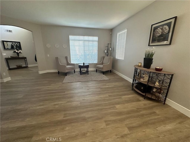 2775 Canyon View Cir, Corona, CA 92882 - sitting room with arched walkways and wood finished floors