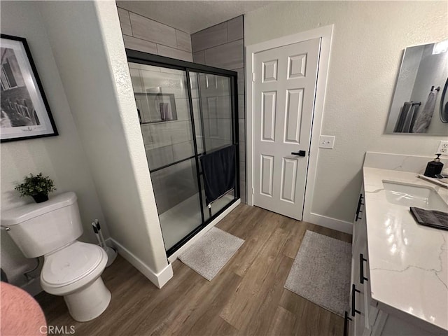 2775 Canyon View Cir, Corona, CA 92882 - bathroom with vanity, wood finished floors, and a stall shower