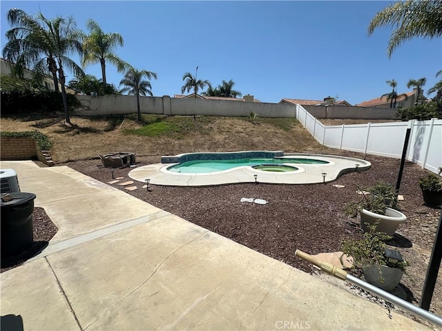 2775 Canyon View Cir, Corona, CA 92882 - view of pool with an in-ground hot tub, a fenced backyard, and a patio area