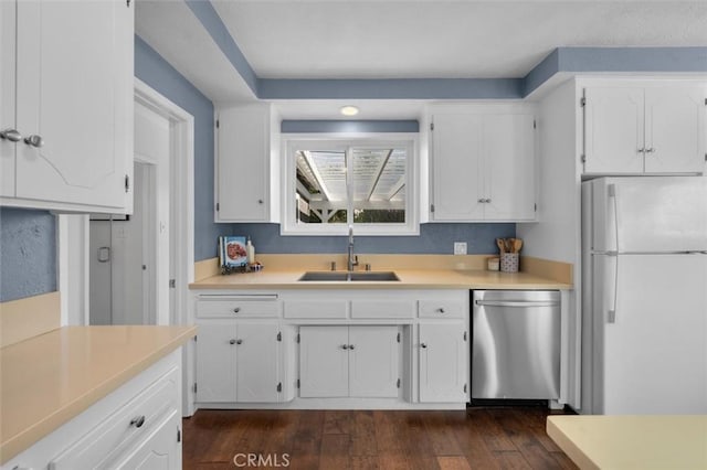 3144 W 154th Pl, Gardena, CA 90249 - kitchen featuring freestanding refrigerator, stainless steel dishwasher, white cabinetry, dark wood-style flooring, and light countertops