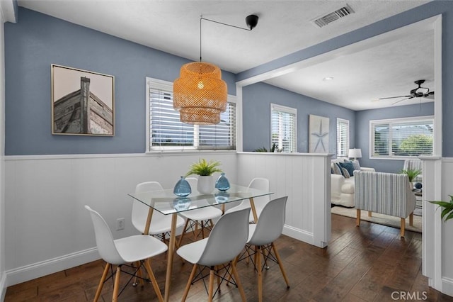 3144 W 154th Pl, Gardena, CA 90249 - dining area featuring wood-type flooring, healthy amount of natural light, wainscoting, a textured ceiling, and a ceiling fan