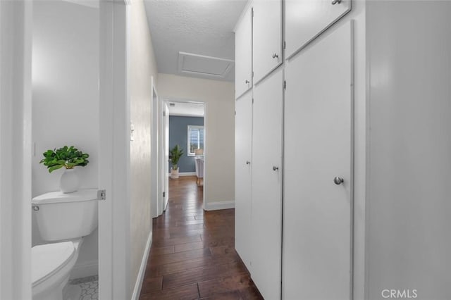 3144 W 154th Pl, Gardena, CA 90249 - hallway with attic access, a textured ceiling, and dark wood-type flooring