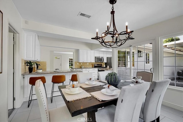 124 Marion Blvd, Fullerton, CA 92835 - dining room with a chandelier and light tile patterned floors