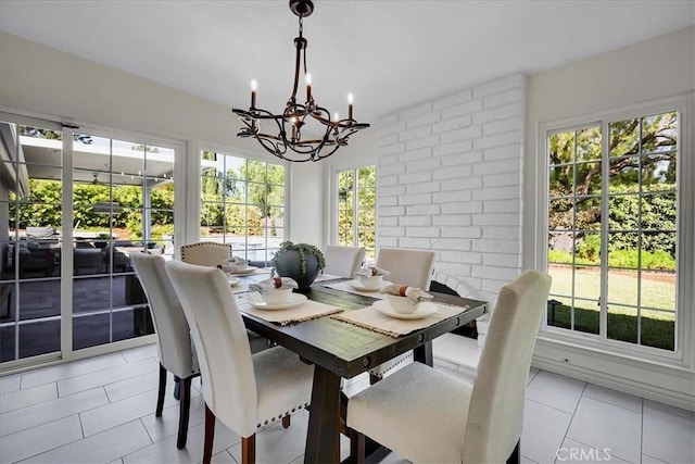 124 Marion Blvd, Fullerton, CA 92835 - dining room featuring light tile patterned flooring and a chandelier