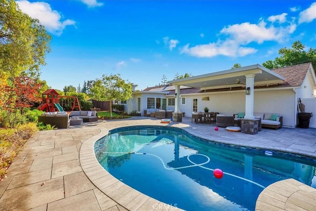 124 Marion Blvd, Fullerton, CA 92835 - view of swimming pool featuring an outdoor living space, a patio, and a playground