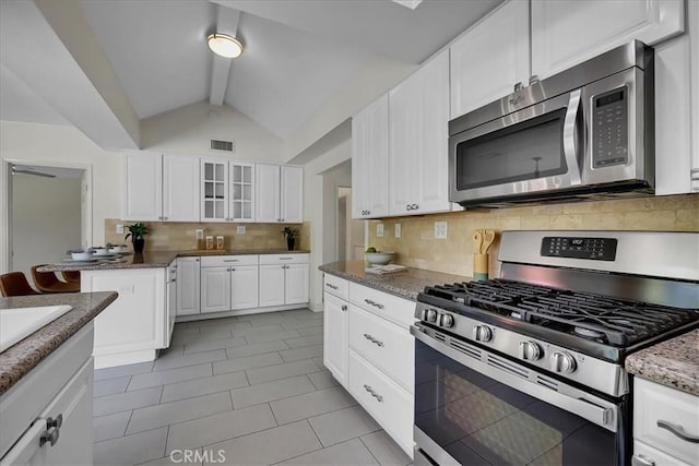 124 Marion Blvd, Fullerton, CA 92835 - kitchen with stainless steel appliances, tasteful backsplash, glass insert cabinets, white cabinets, and light tile patterned floors