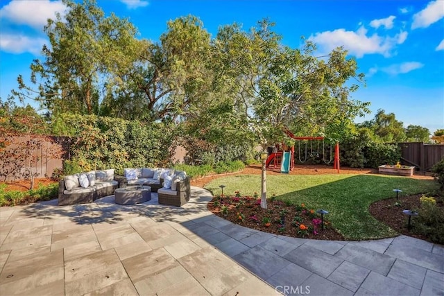124 Marion Blvd, Fullerton, CA 92835 - fenced backyard featuring an outdoor living space with a fire pit, a playground, and a patio