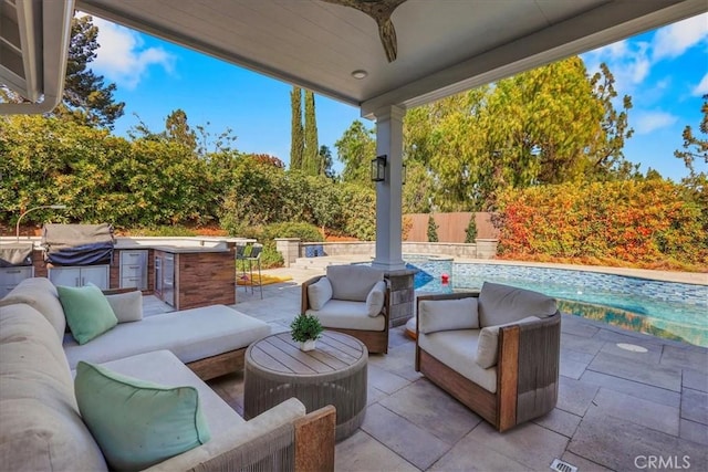 124 Marion Blvd, Fullerton, CA 92835 - fenced backyard with outdoor lounge area, an outdoor kitchen, and a patio area