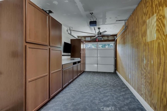 124 Marion Blvd, Fullerton, CA 92835 - garage featuring ceiling fan and a garage door opener