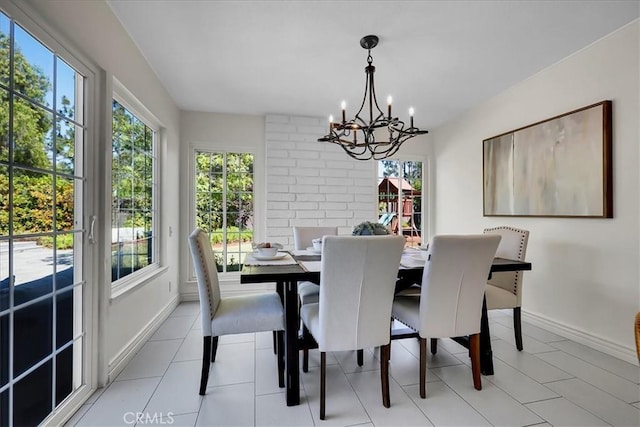 124 Marion Blvd, Fullerton, CA 92835 - dining room featuring a chandelier and baseboards