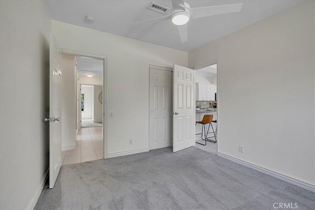 124 Marion Blvd, Fullerton, CA 92835 - unfurnished bedroom featuring carpet flooring, tile patterned flooring, and ceiling fan