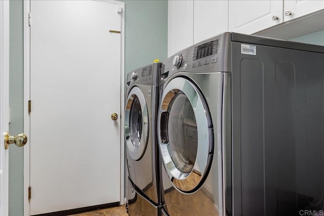 1601 Sapphire, Carlsbad, CA 92011 - washroom with cabinet space and washing machine and clothes dryer