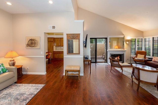 3762 Via Pacifica Walk, Oxnard, CA 93035 - living area featuring high vaulted ceiling, a fireplace, hardwood / wood-style floors, and recessed lighting