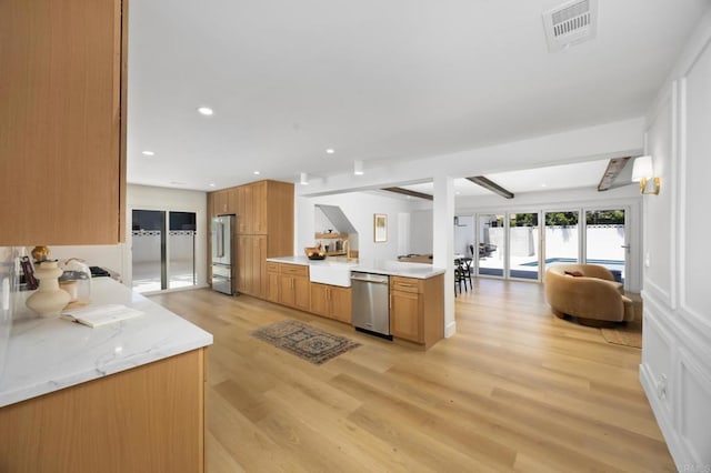 11741 Foster Rd, Los Alamitos, CA 90720 - kitchen with appliances with stainless steel finishes, light wood-type flooring, beam ceiling, open floor plan, and brown cabinetry